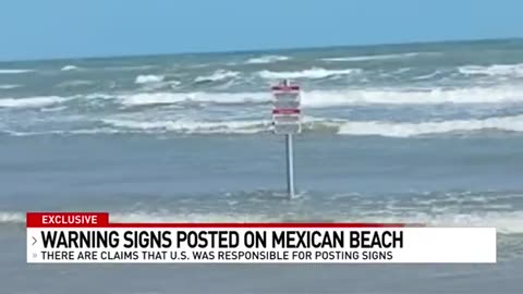 Warning signs installed on Mexican beach declaring area restricted by U.S.