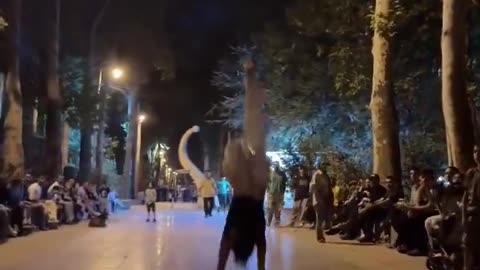 Brave Iranian girl challenges the Islamic regime by performing gymnastics in public.