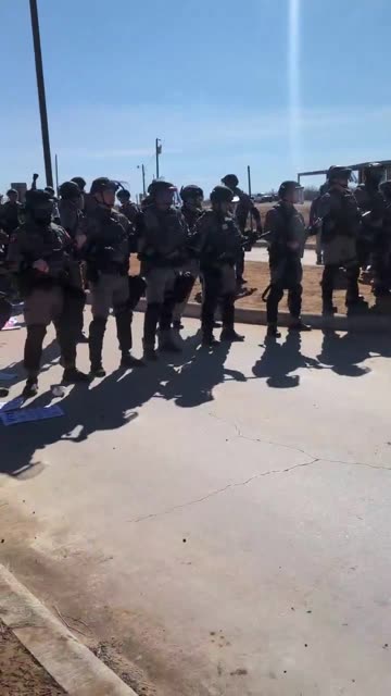 Peacefully protesting where 5-year old Liam Ramos has been detained,