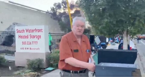 Storage Worker The Holds ANTIFA Gear Talks With Tommy Boi Near Portland ICE Protest