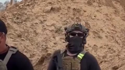 An American mercenary alongside two Egyptian security forces in Gaza