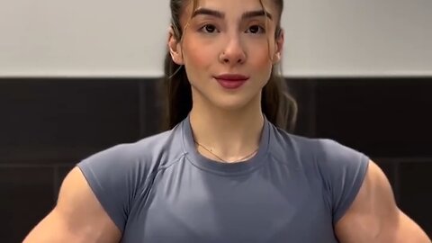Beautiful muscle girl flexing