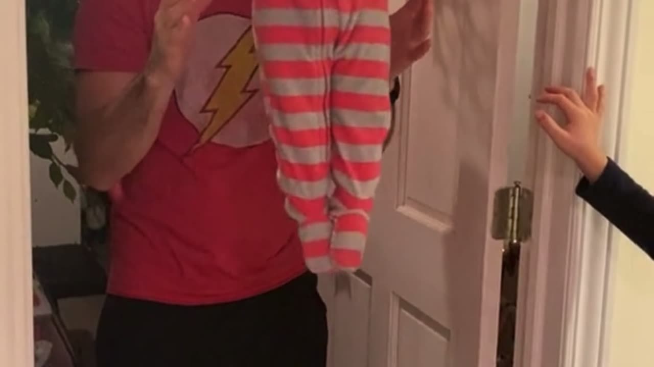 Baby Tries Pull-Ups With a Little Help From Dad