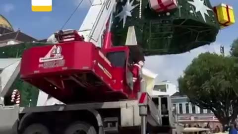 The tow truck operator dressed as Santa Claus