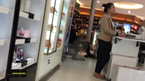 Sales lady attending to customers...