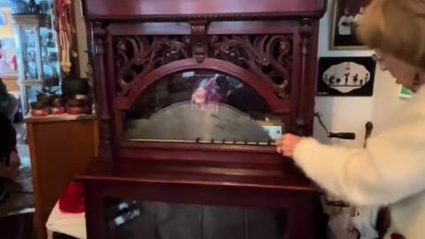 woman playing her 27-inch Regina