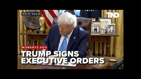 President Donald Trump signs executive orders with gaggle of reporters in Oval Office