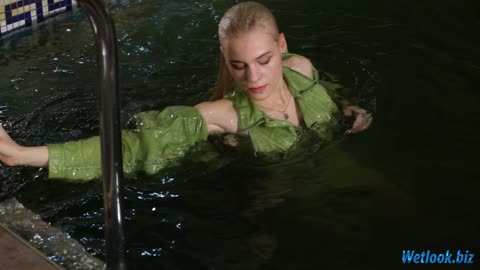 Wetlook girl in green denim dress