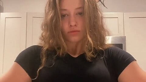 Beautiful muscle girl flexing