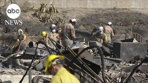 firefighters race to contain flames before winds back up