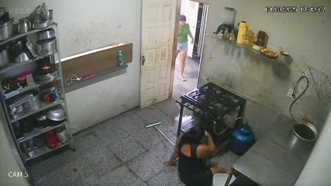 Woman Slips and Falls While Mopping Kitchen