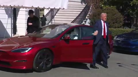 President Trump checks out his new red Tesla