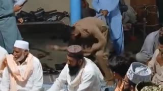 Women in Pakistan are locked indoors while men celebrate by twerking with other men.