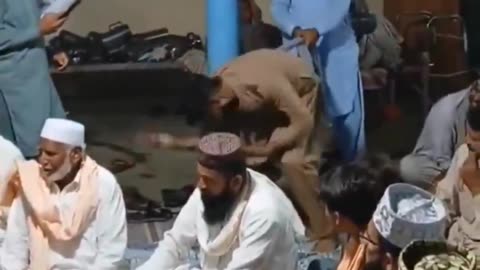 Women in Pakistan are locked indoors while men celebrate by twerking with other men.