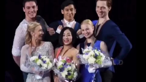 Figure skaters lift teammate for podium photo