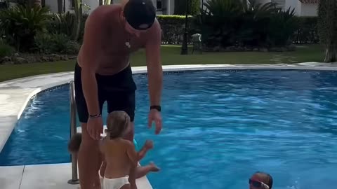This Toddler Patiently Waits for Her Turn to Jump Into the Pool so be it in my dreams · dad sports