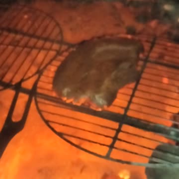 Cooking Steak in mine shaft in stone barbacoa