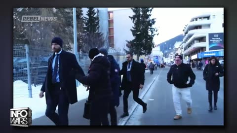 Larry Fink Confronted Face-to-Face At Davos For His Crimes Against Humanity!