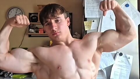 Young man flexing muscles
