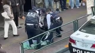 Japanese police burrito wrapping a violent black man