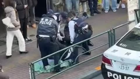 Japanese police burrito wrapping a violent black man