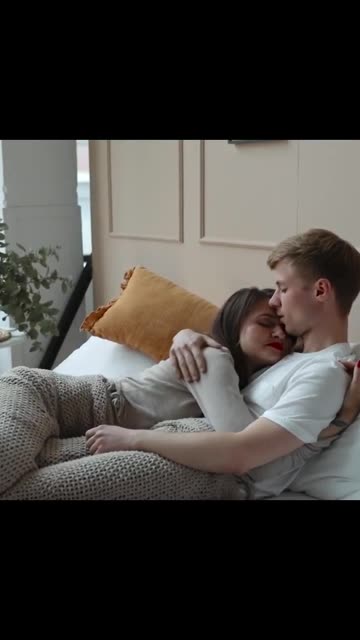 Sweet Couple Cuddling in Bed