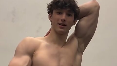 18 years old teen boy flexing muscles