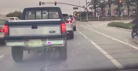 Shocking Phoenix Rain Crash: Motorcyclist Runs Red Light, Bike Erupts in Flames – Dashcam Footage