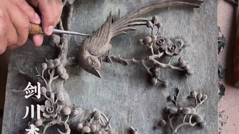 A chinese man crafting beautiful decoration Art with hand