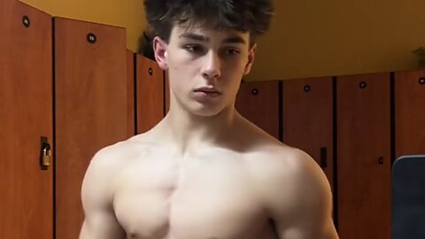 17 years old aesthetic bodybuilder flexing muscles