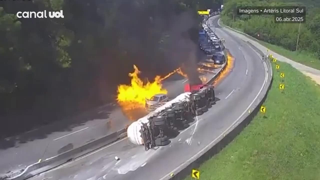 Tank truck crashes and explodes, destroying 27 cars.