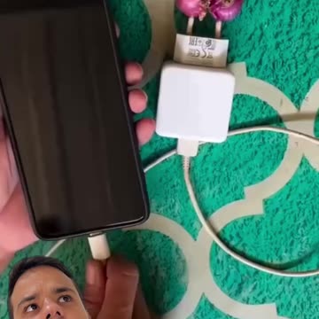 Charging a phone with a coin and garlic 🤔