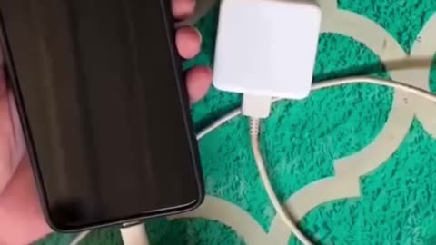 Charging a phone with a coin and garlic 🤔