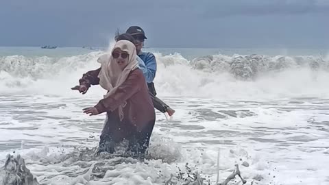 Wave Crashes on Family Trying to Take Aesthetic Video