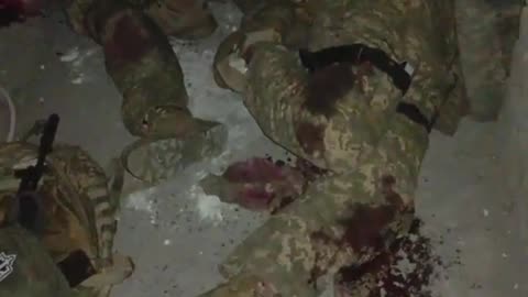 finishes off his own wounded Ukrainian Armed Forces soldier.