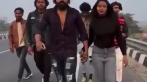 In India, a group of influencers filming a video for TikTok while crossing a highway