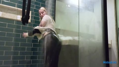 Wetlook girl shower dressed in sweatpants