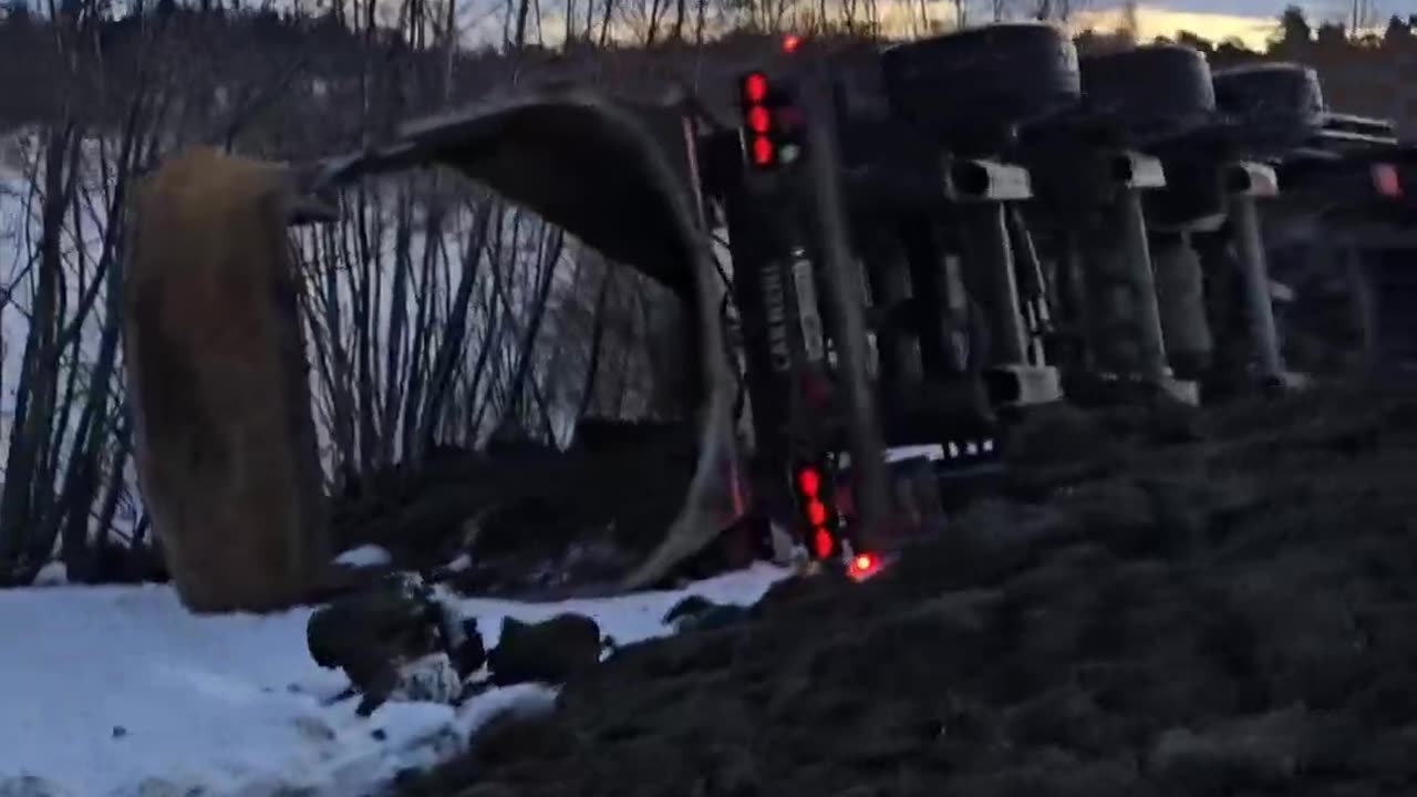 Truck Tips Over While Backing Up In Snow