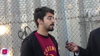 Communist outside a Mamdani rally