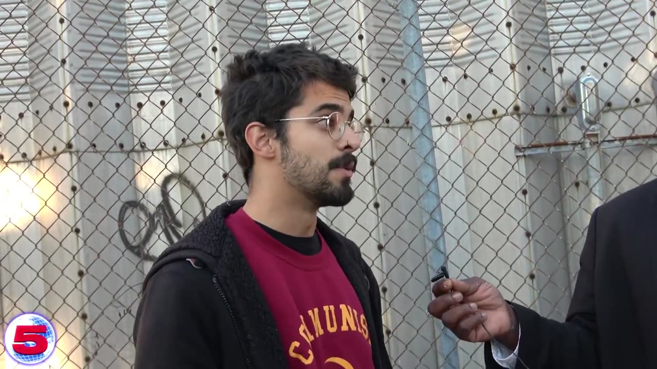 Communist outside a Mamdani rally