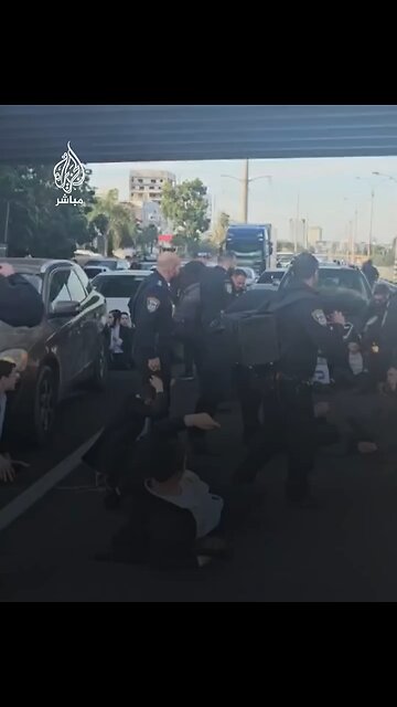 Dozens of #Haridim closed a street east of Tel Aviv to protest the arrest of the police