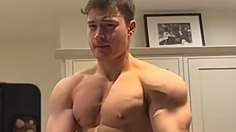 Young man flexing muscles