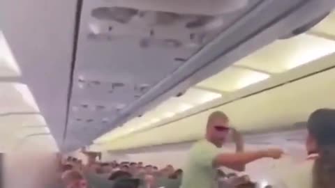 A passenger on a flight freaks out after seeing inhuman. They walk among us