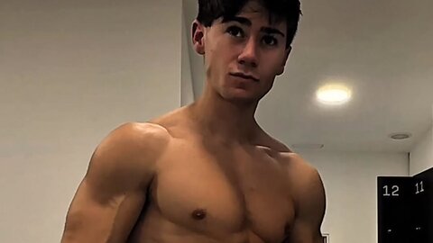 Handsome muscular guy showing off his muscles