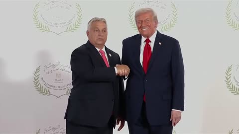 wild hand jerking during Trump's handshake photo op with Orban