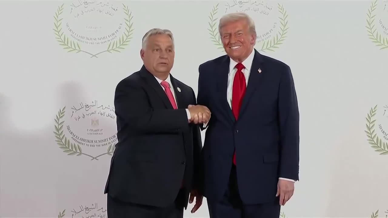 wild hand jerking during Trump's handshake photo op with Orban