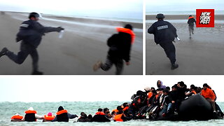 Dramatic moment police face off with 100 migrants running towards boat in France