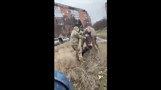 Zelensky's Goons try to kidnap man for front lines before woman w/ baby saves him