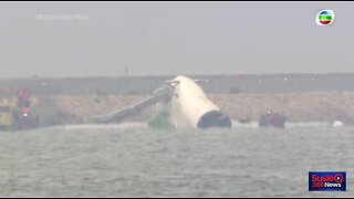 Cargo plane skids off Hong Kong runway into sea during landing