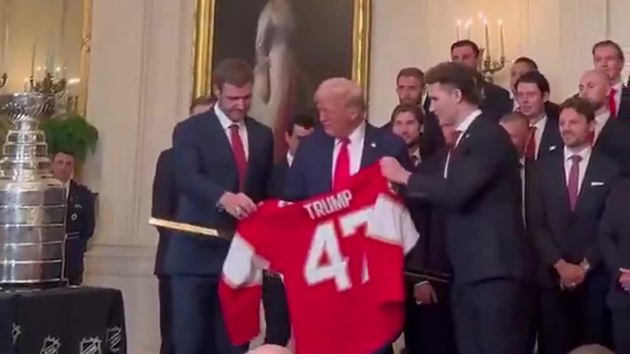 🚨 President Trump was just gifted a GOLD HOCKEY STICK and a Trump Jersey